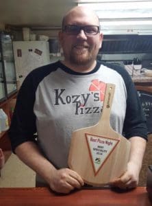 kozys owner matt with award 1
