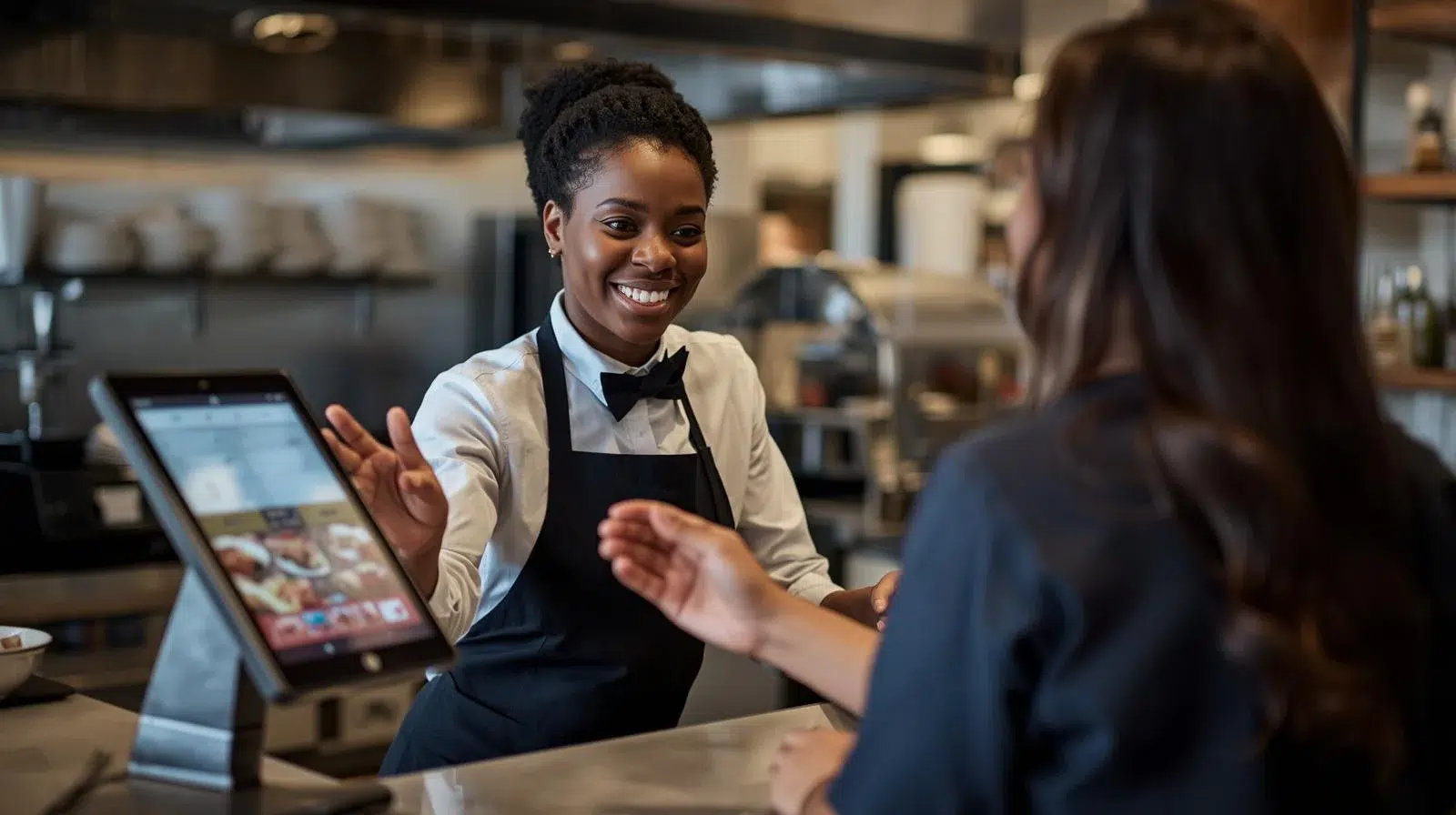 restaurant employee standing behind a counter