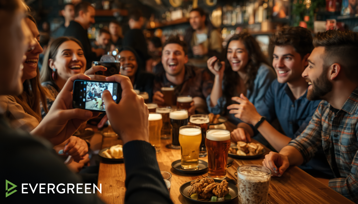 bar scene with a group of friends taking photos of craft beers and posting on social media
