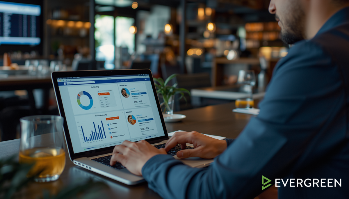 bar owner analyzing Facebook advertising performance metrics on a laptop inside a modern restaurant or bar office