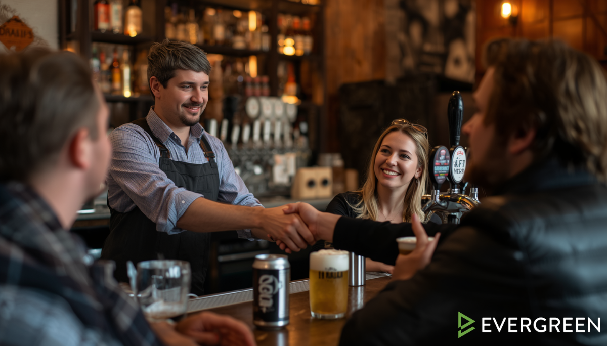 bar owner warmly greeting a returning customer